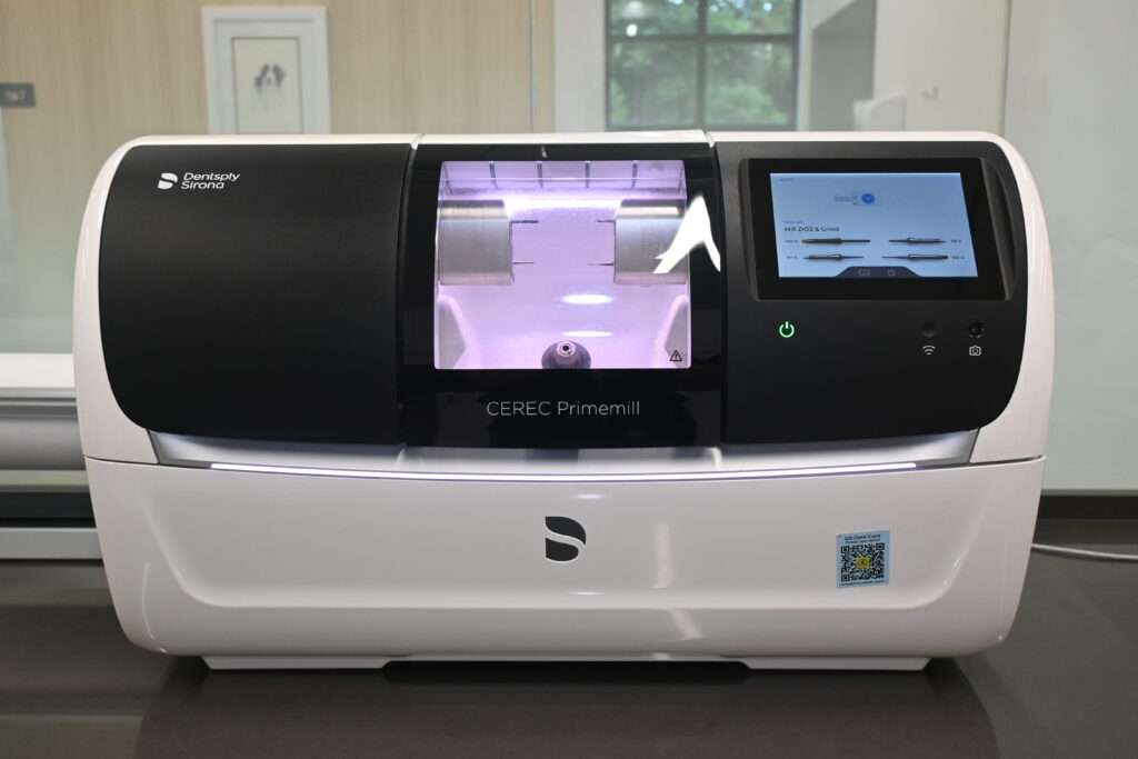 Dentsply Sirona CEREC Primemill CAD/CAM machine used for milling same-day ceramic crowns at Premier Prosthodontics in-house lab.
