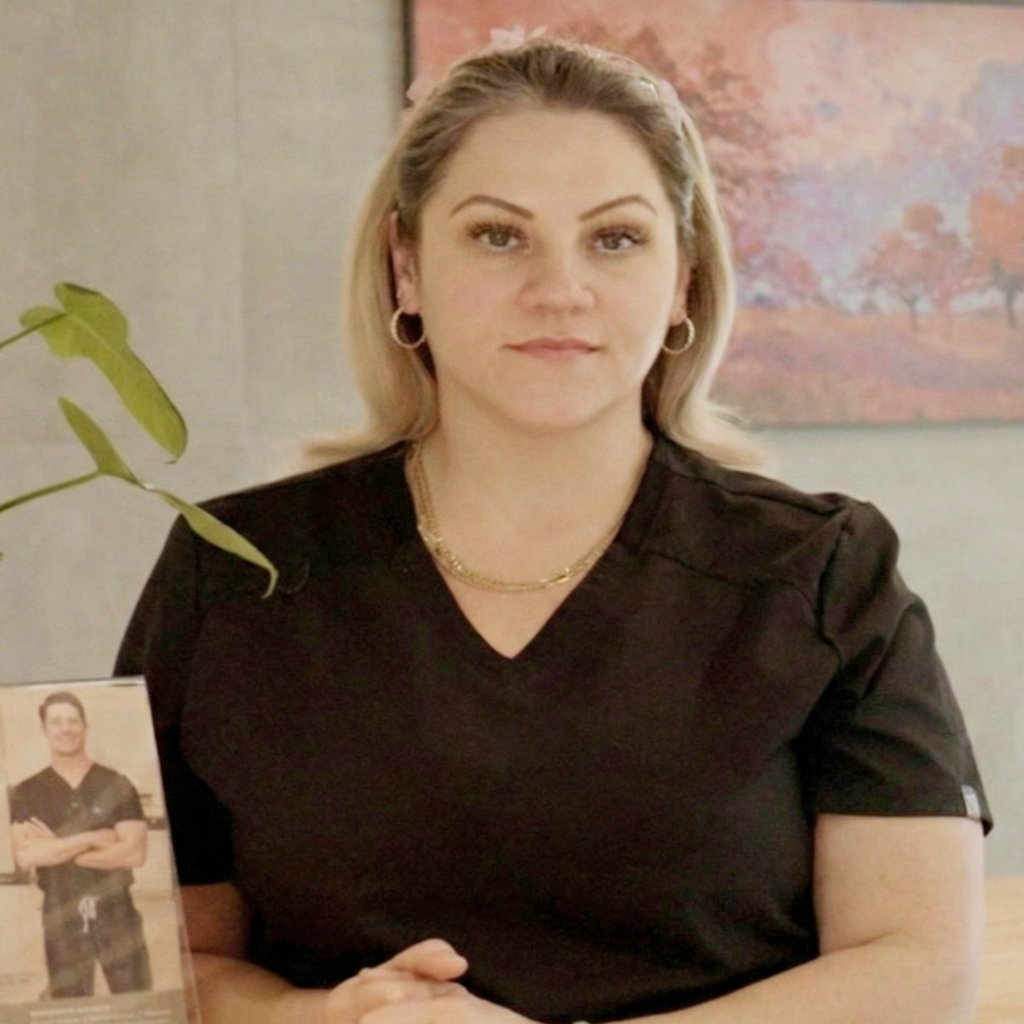 Portrait of Jamie Mansfield, a dental assistant wearing black scrubs at Premier Prosthodontics.
